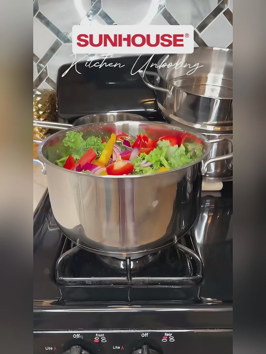 Stainless steel pot with vegetables on a stove, Sunhouse brand visible